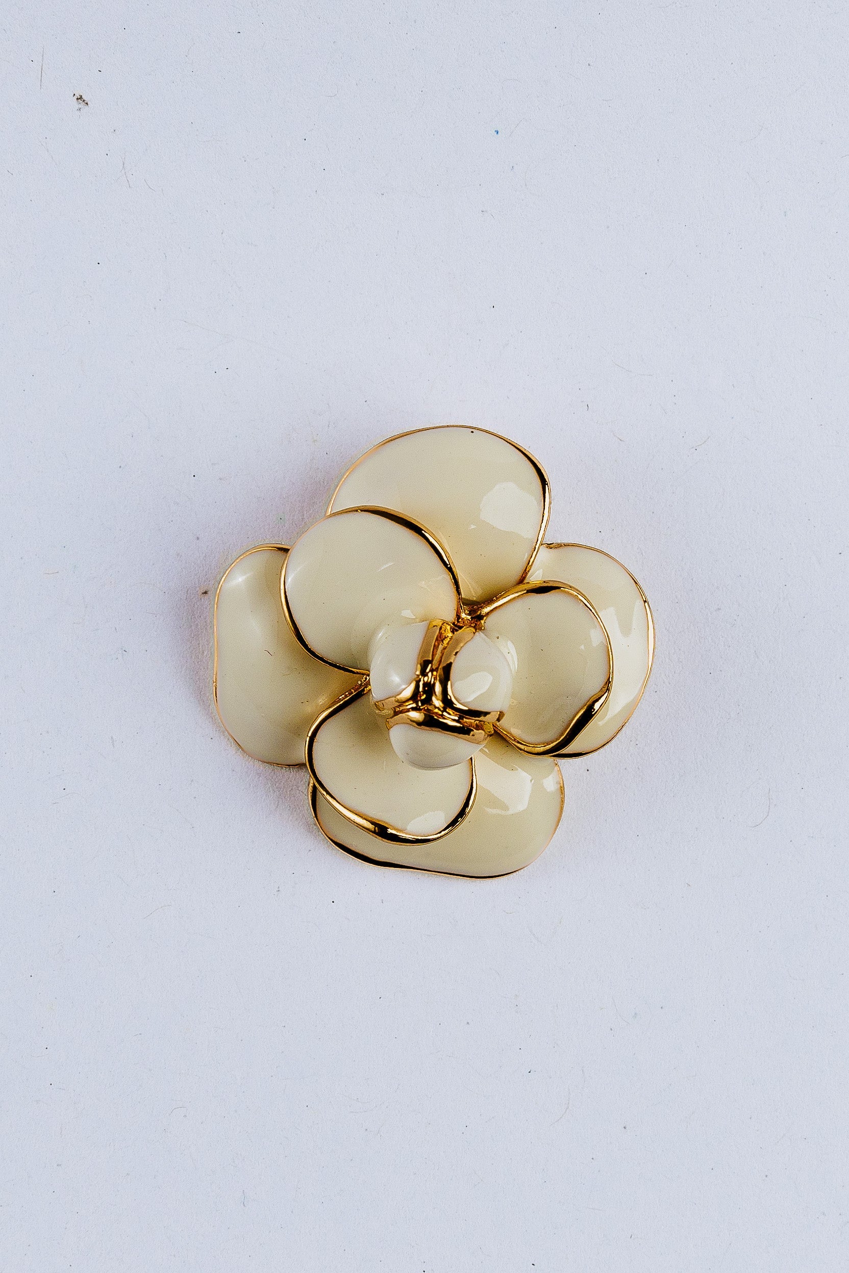 Gold and white camellia-shaped flower charm