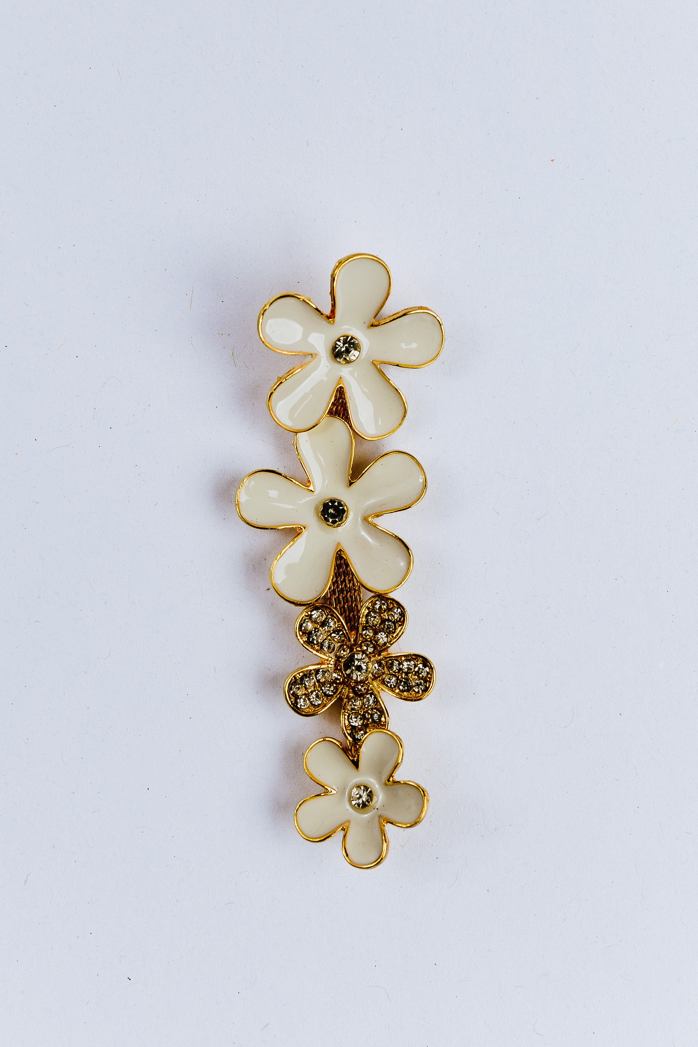 white Floral charm with gold accents