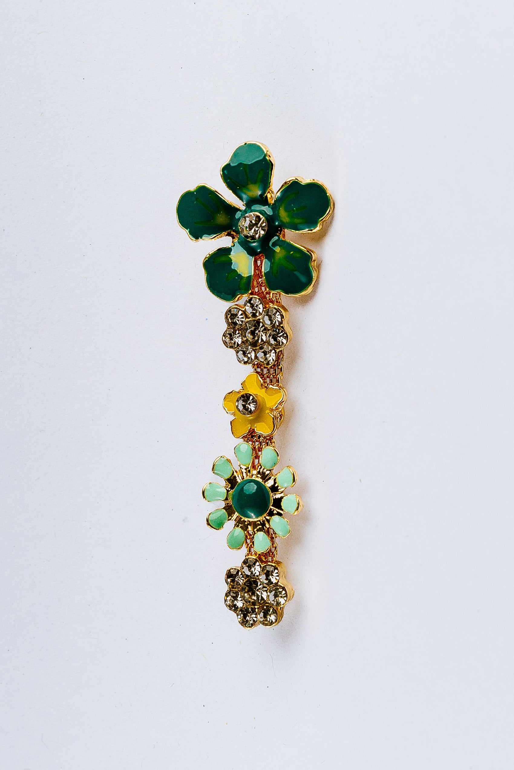 Decorative flowerettes charm with green, yellow, and gold gemstones