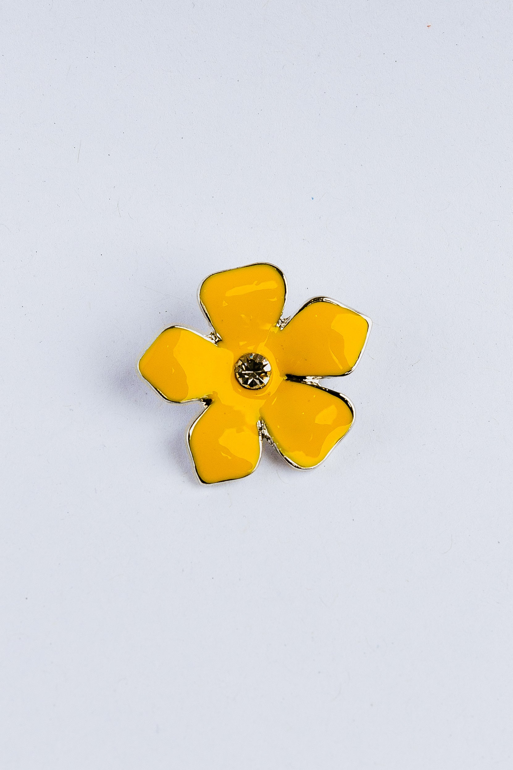 Yellow flower-shaped charm