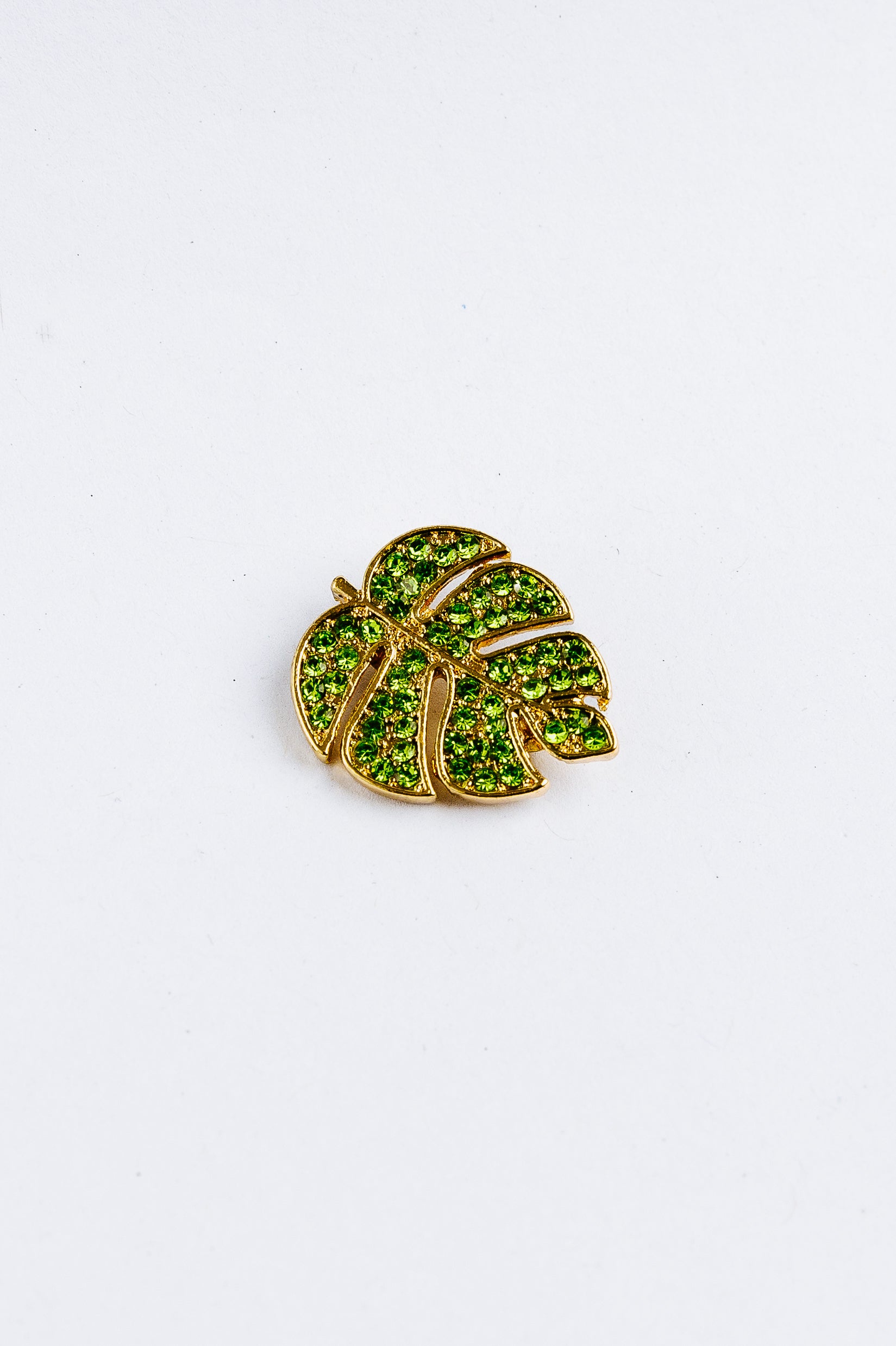 Green leaf-shaped monstera with gemstones 