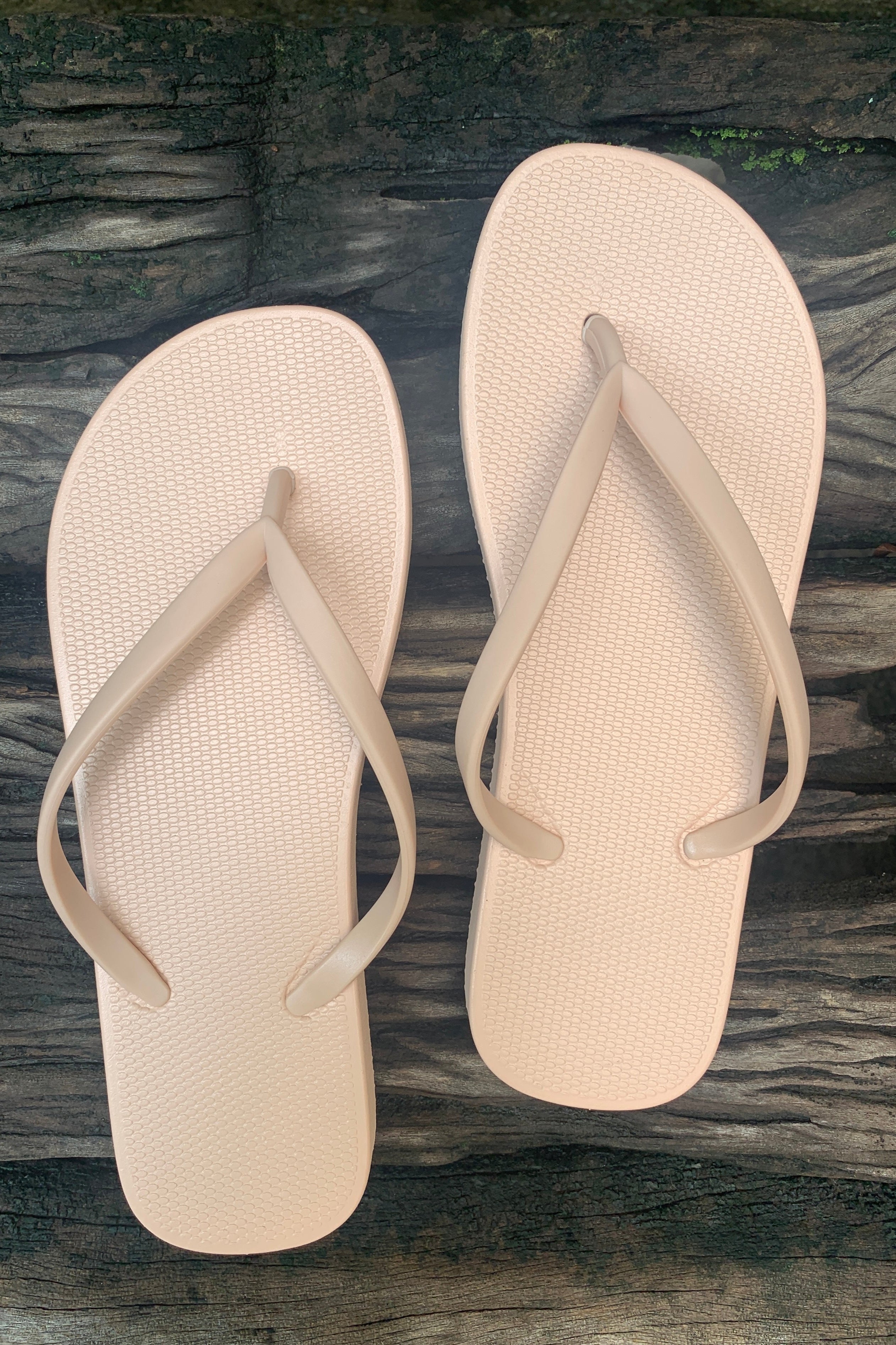 Pair of beige flip-flops 