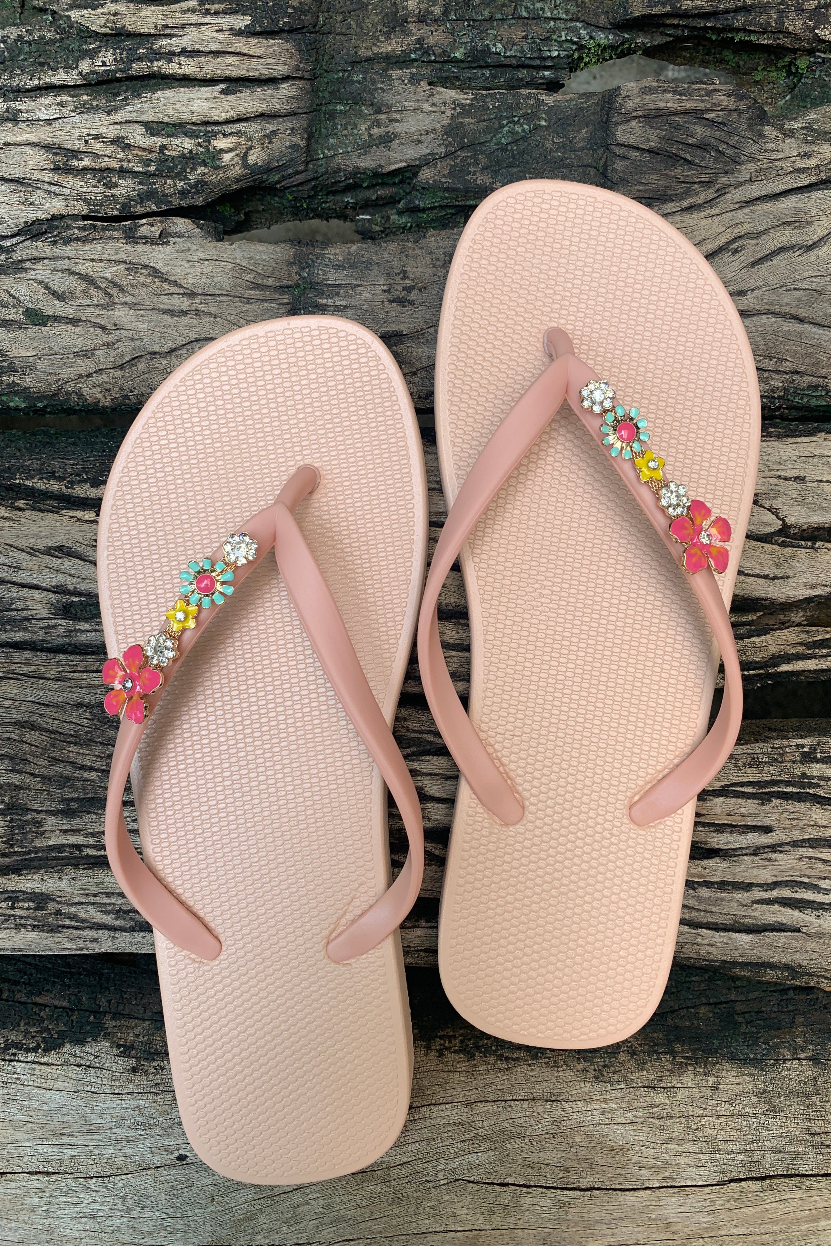 rose flip-flops with decorative pink  flower charms 